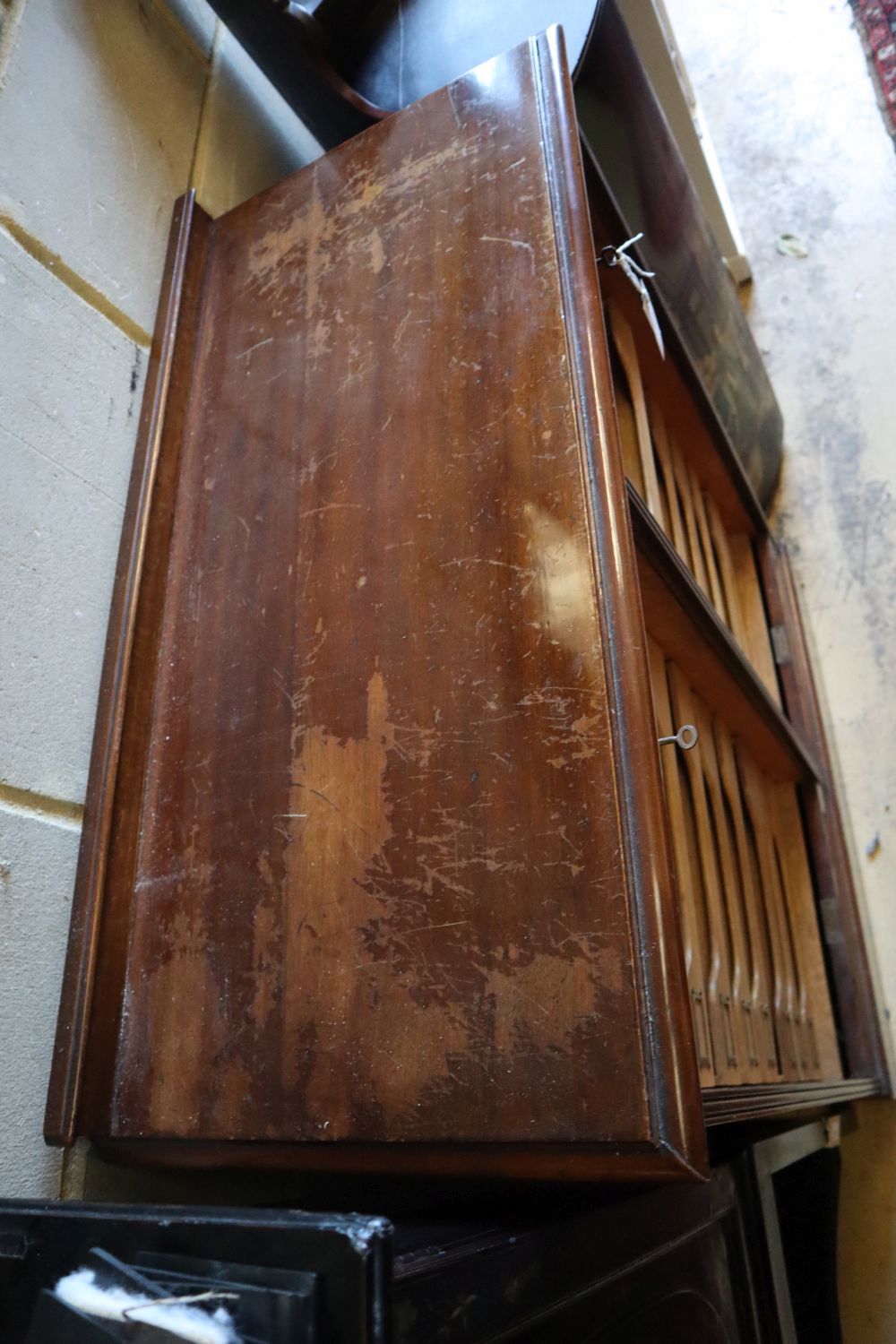 A walnut double tambour filing cabinet, circa 1935, fitted sliding trays, width 90cm, depth 42cm, height 116cm